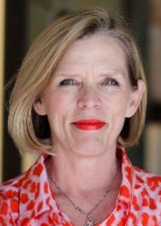 image a woman with shoulder length blonde hair wearing red liptick and a red and pink button up shirt